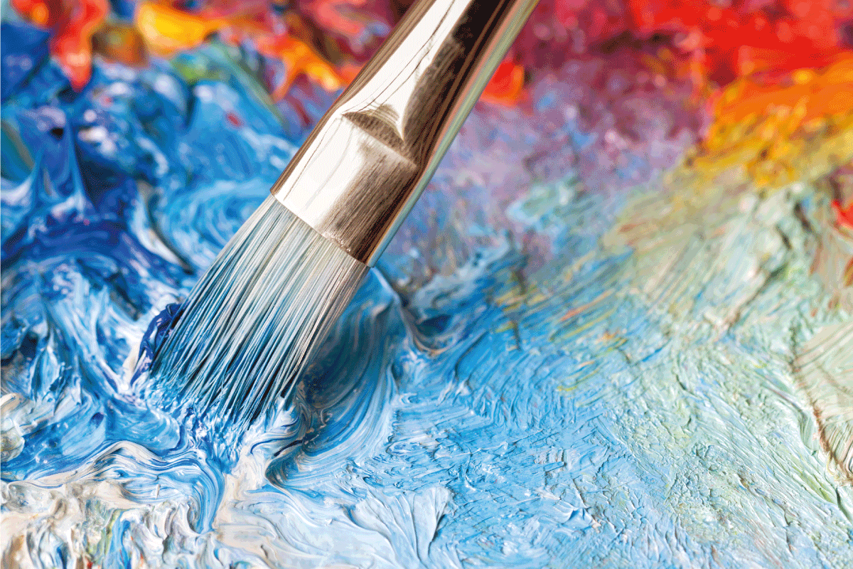 Paintbrush-with-oil-paint-on-a-classical-palette.-What-Paint-To-Use-On-Picture-Frames