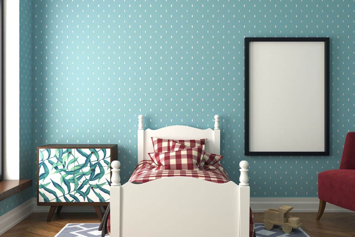 Patterned beddings with a floral nightstand inside a blue polka dotted bedroom