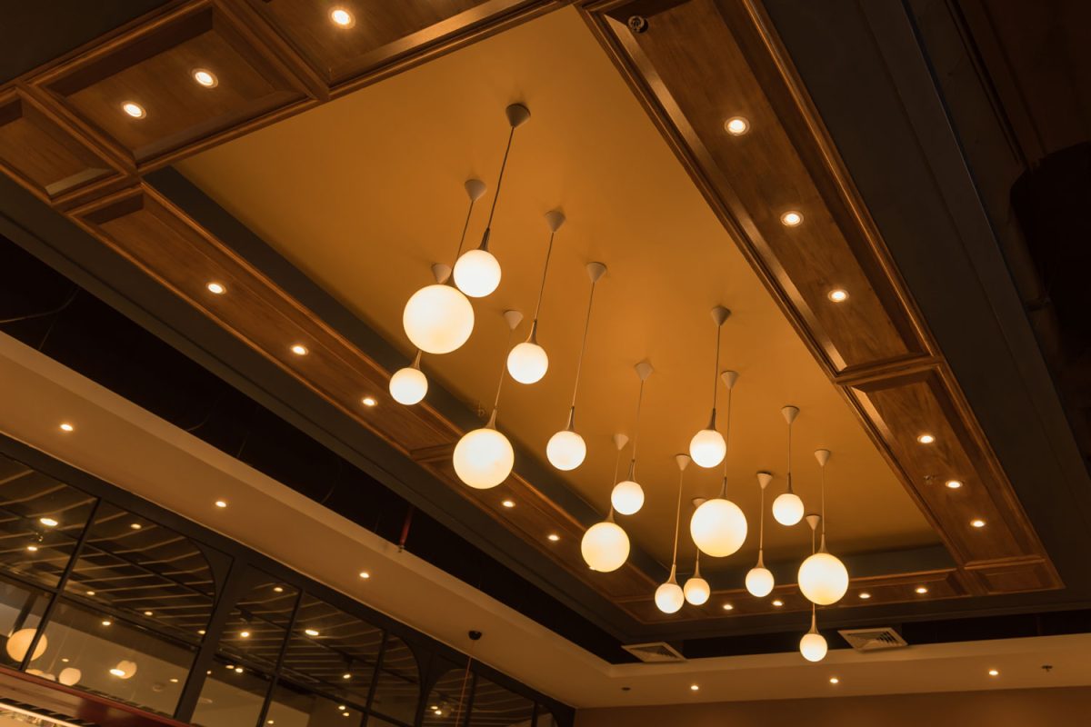 Round dangling light fixtures inside an expensive restaurant