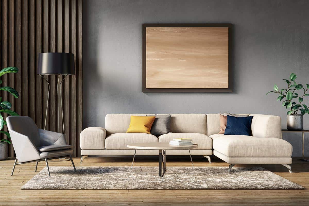 A scandinavian interior design with gray and beige colored furniture and wooden elements, What Color Cushions Go With A Beige Sofa?
