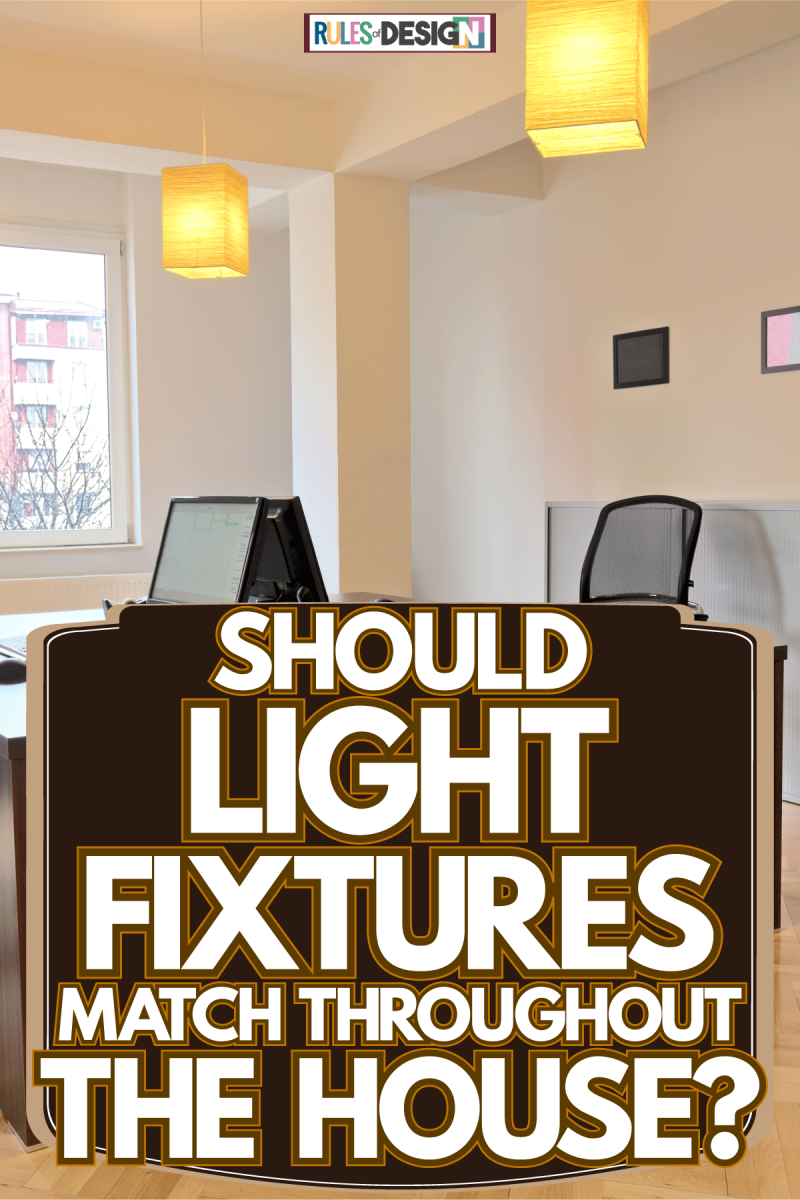 A classy home office designed with wooden tables, lanterns for lighting and laminated flooring, Should Light Fixtures Match Throughout The House?