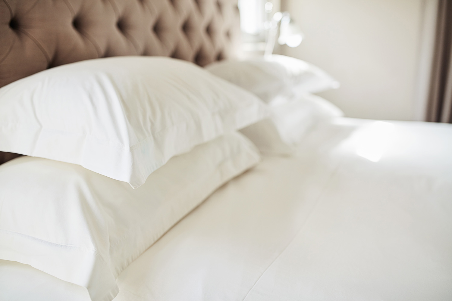 Shot pillows on a bed in a modern hotel. So fresh and so clean.