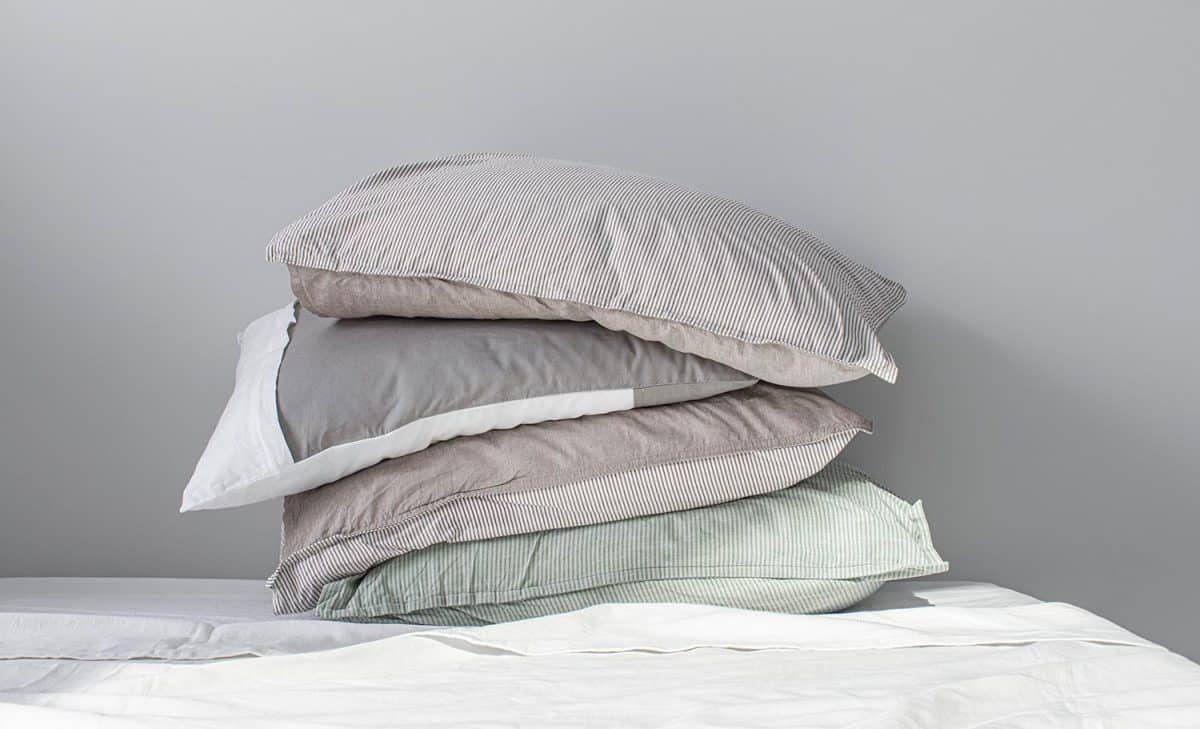 Stack of pillows in pillow cases made of natural materials
