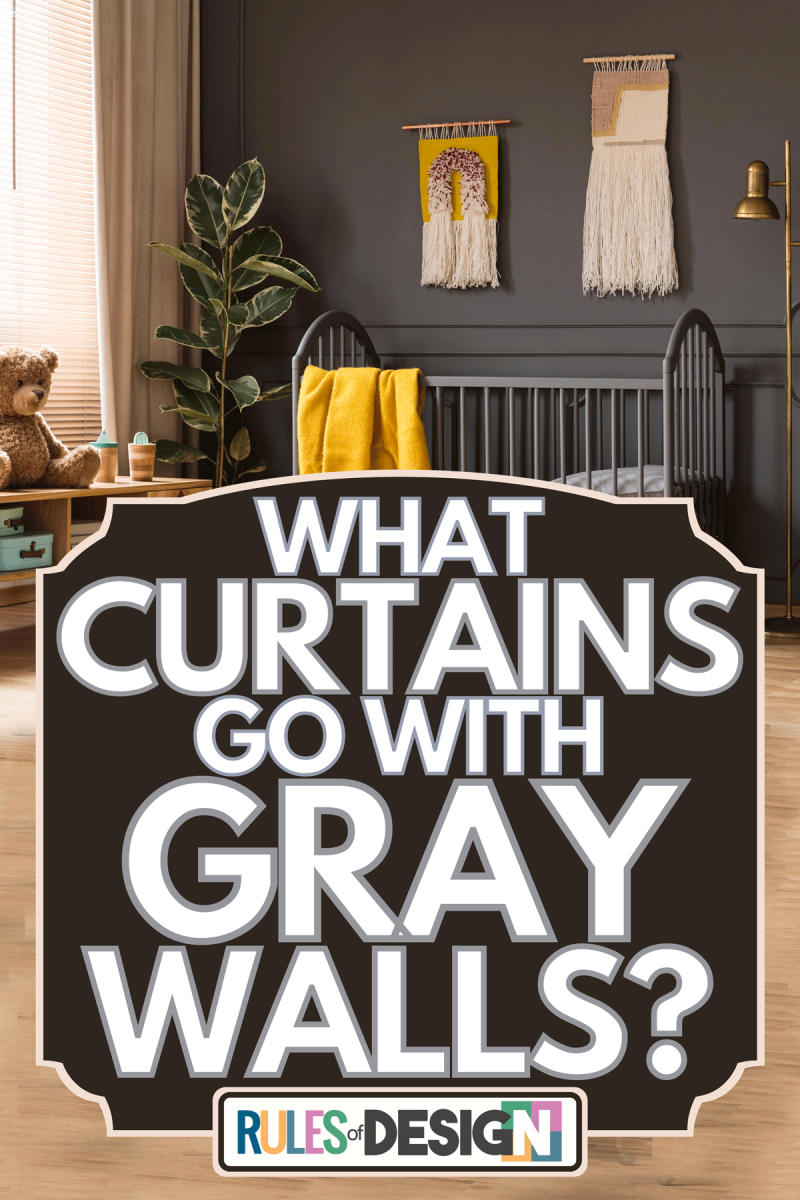 A baby room interior with a yellow blanket standing between a low cupboard with a bear and a lamp, What Curtains Go With Gray Walls?