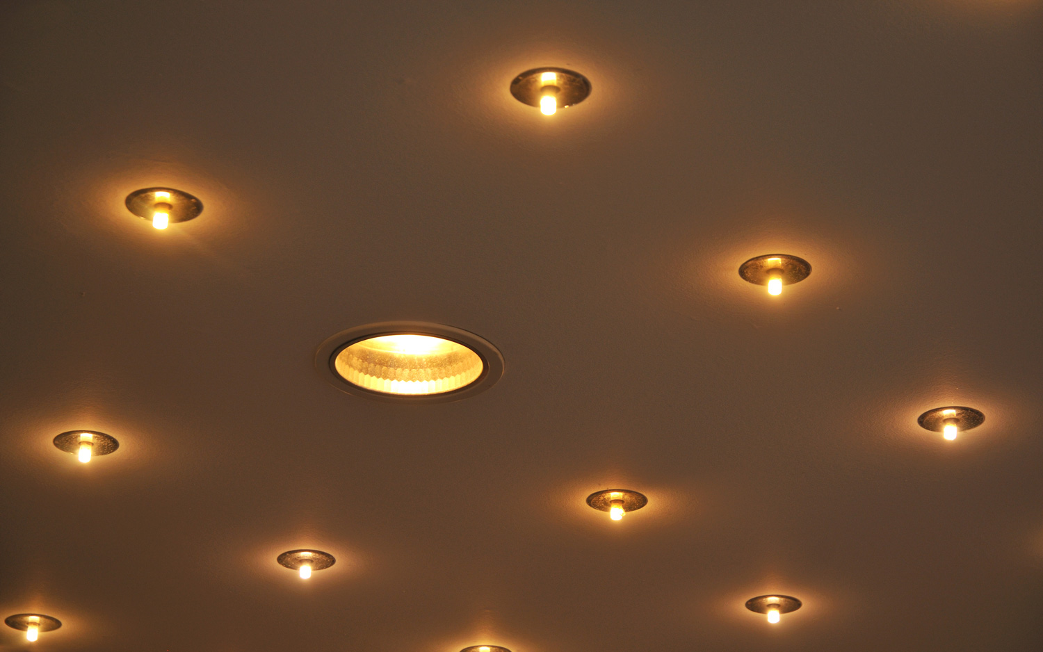 illuminated ceiling with recessed halogen lamps