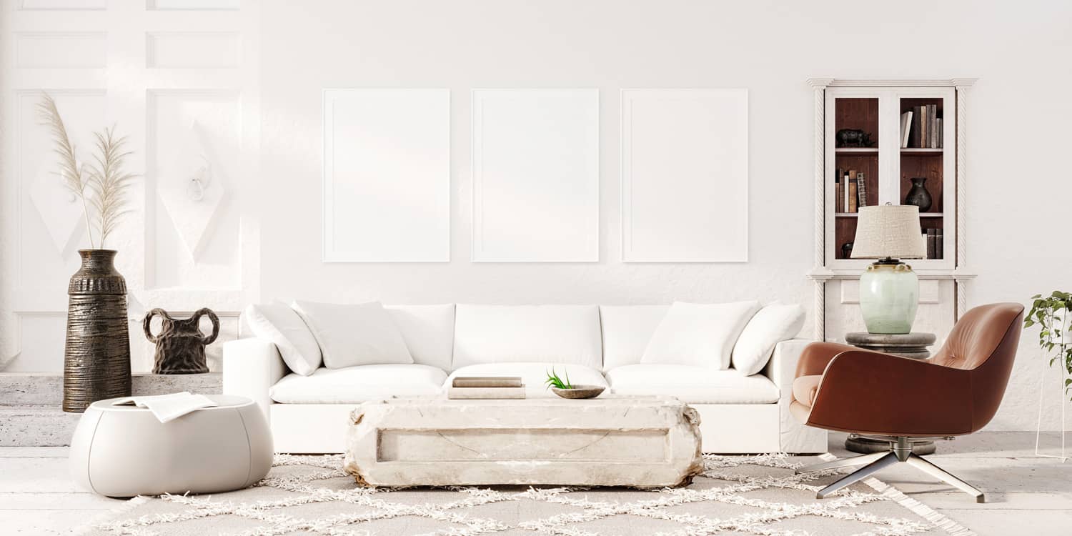 Modern white living room interior design with decoration and empty mock up picture frames