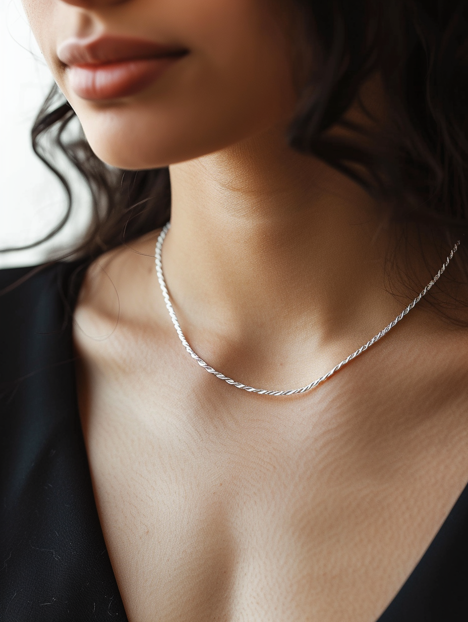 Create an image of a chic, minimalist silver chain necklace